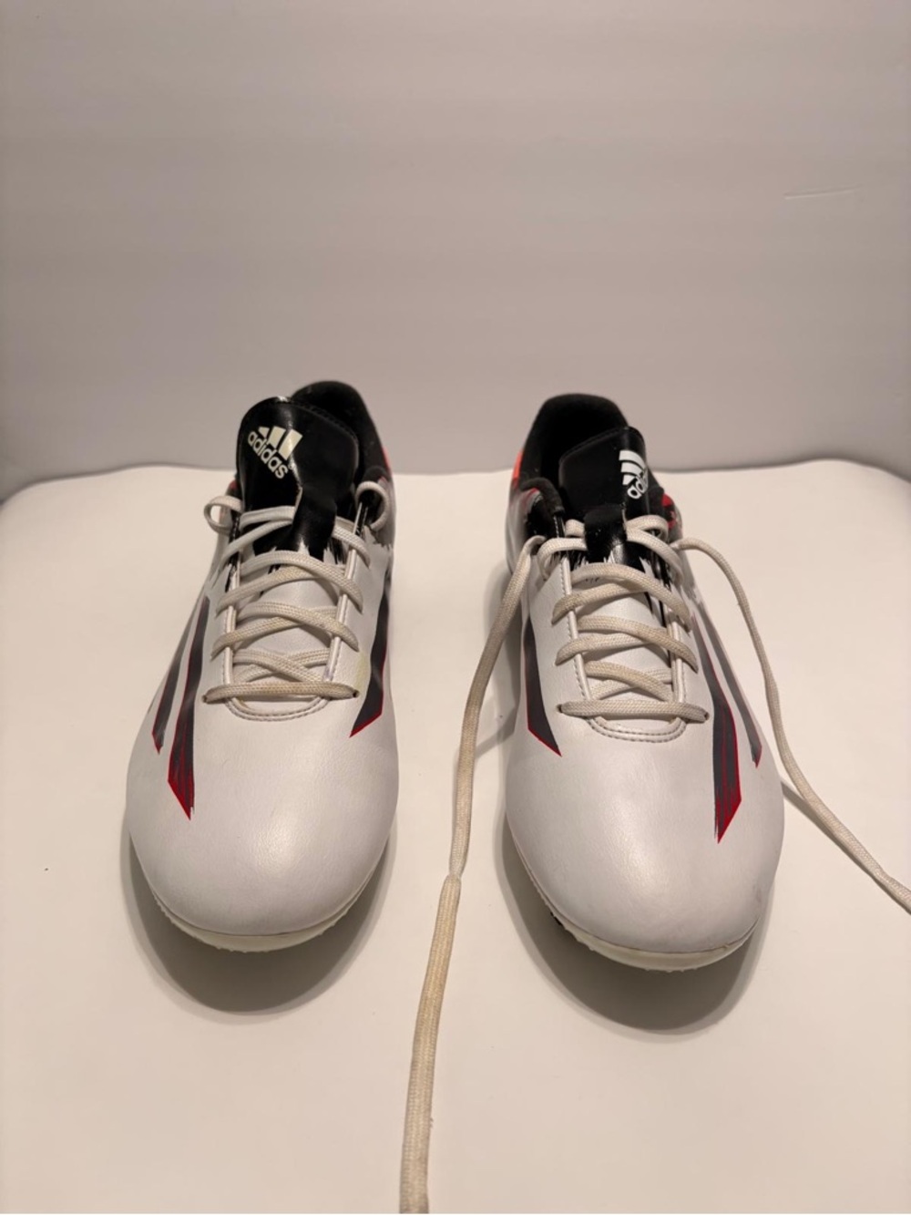 adidas Men's White Athletic Soccer Shoes with Black and Red Accents